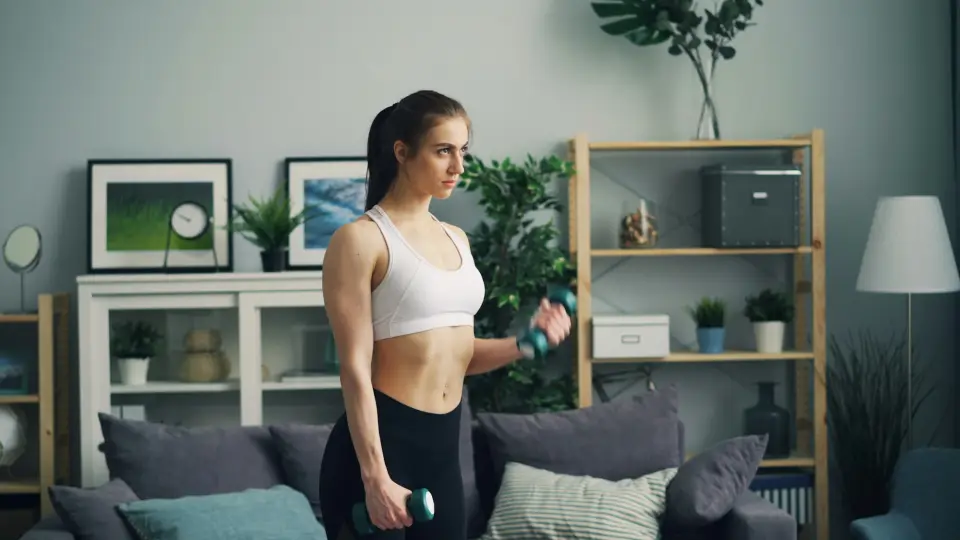 Client training at home with dumbbells